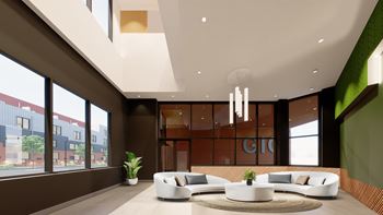 a lobby with couches and a coffee table